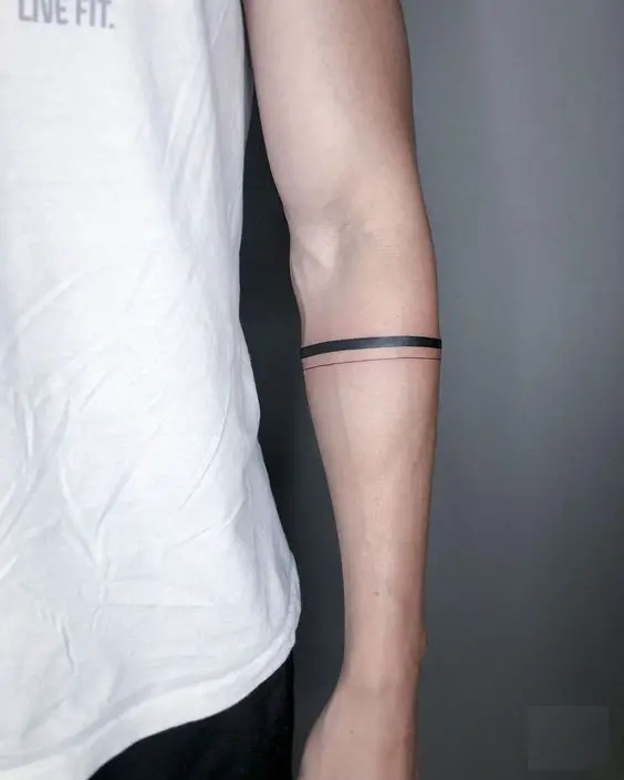 Explore 2024's Top Minimalist Tattoos for Men with Meaning