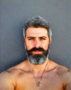 Beard & Hair Harmony: Top Men's Styles from Buzz Cuts to Long Waves